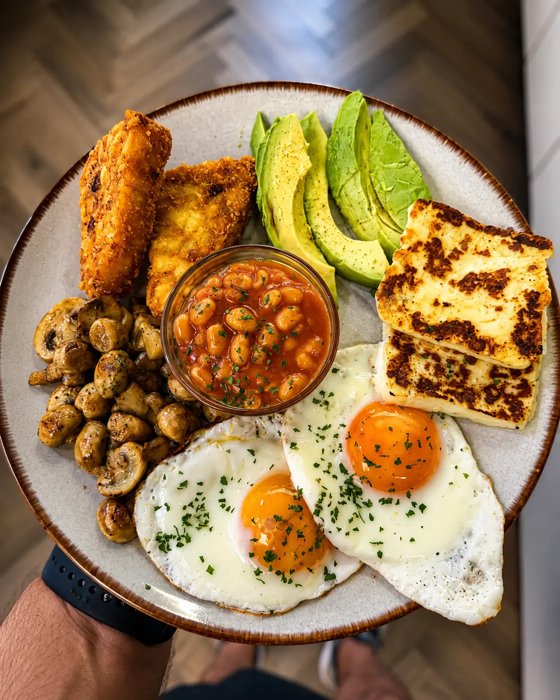 Brunch plate with fried eggs, avocado and halloumi